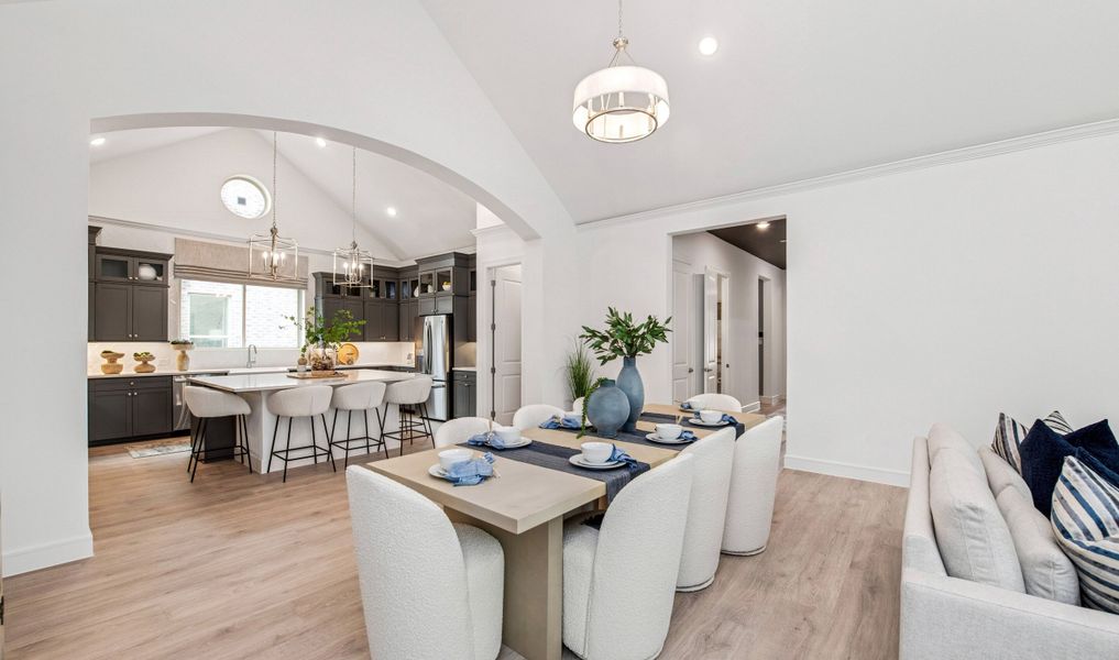 Dining area with striking archway to kitchen Dining area with striking archway to kitchen
