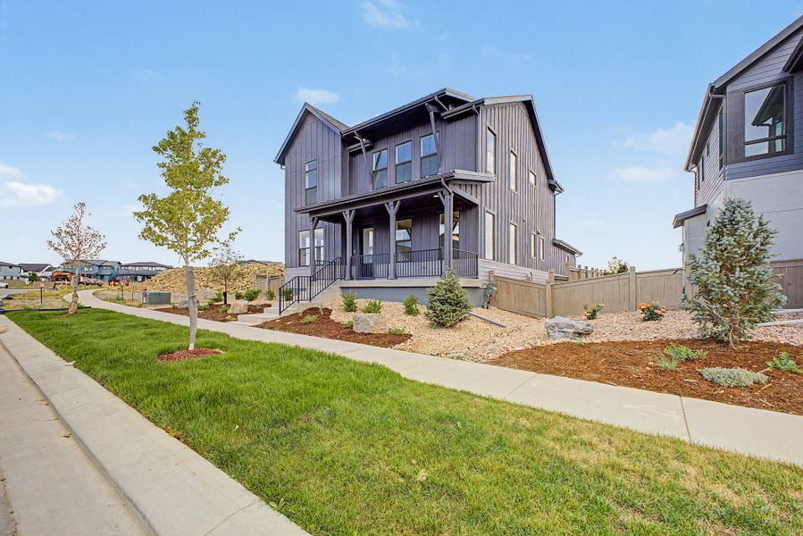 Front exterior of a new home in West Grange, Longmont, CO, highlighting curb appeal (Image 15). Front exterior of a new home in West Grange, Longmont, CO, highlighting curb appeal (Image 15).