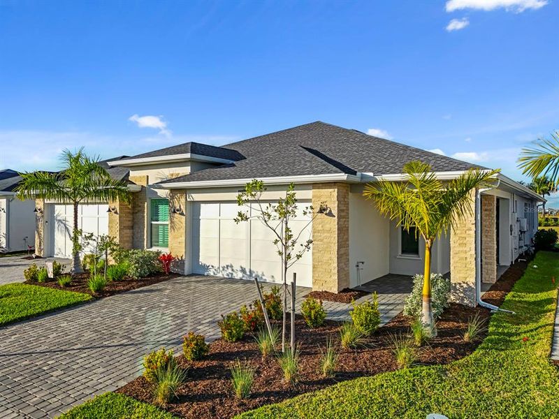 Front exterior of a new home in , Punta Gorda, FL, highlighting curb appeal (Image 23).
