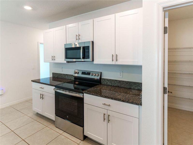 Furnished interior view inside a new home in The Isle of Avalon, Spring Hill (Image 7).