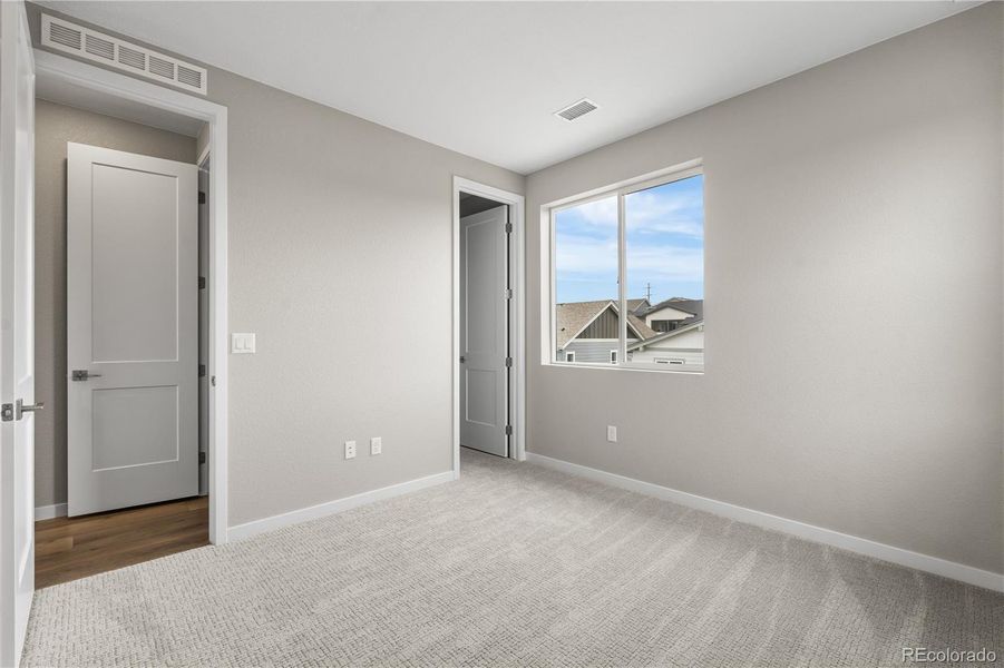 Spacious, unfurnished interior of a new home in Tribute at Lyric, Lone Tree (Image 30).