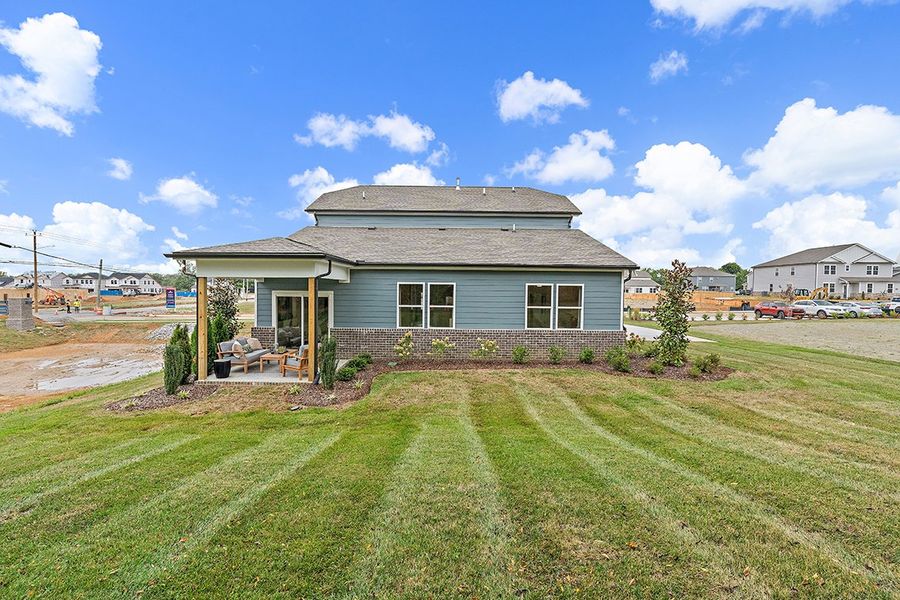 A house with a grass yard. A house with a grass yard.