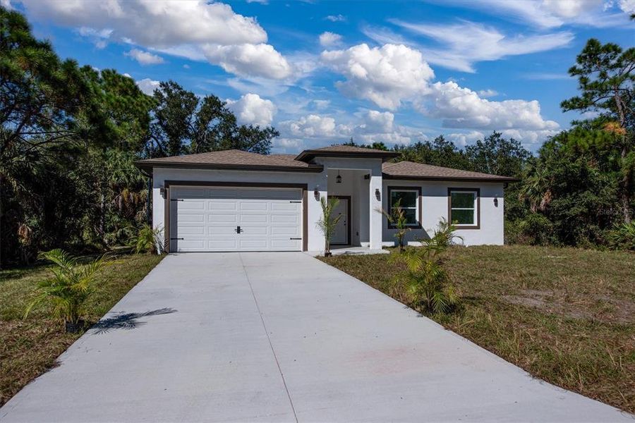 Front exterior of a new home in , Punta Gorda, FL, highlighting curb appeal (Image 33). Front exterior of a new home in , Punta Gorda, FL, highlighting curb appeal (Image 33).