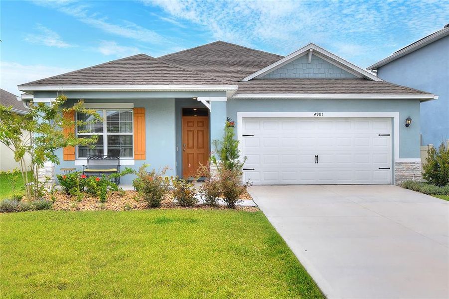 Front exterior of a new home in Summerlin at Hawthorne Ranch, Lakeland, FL, highlighting curb appeal (Image 1). Front exterior of a new home in Summerlin at Hawthorne Ranch, Lakeland, FL, highlighting curb appeal (Image 1).