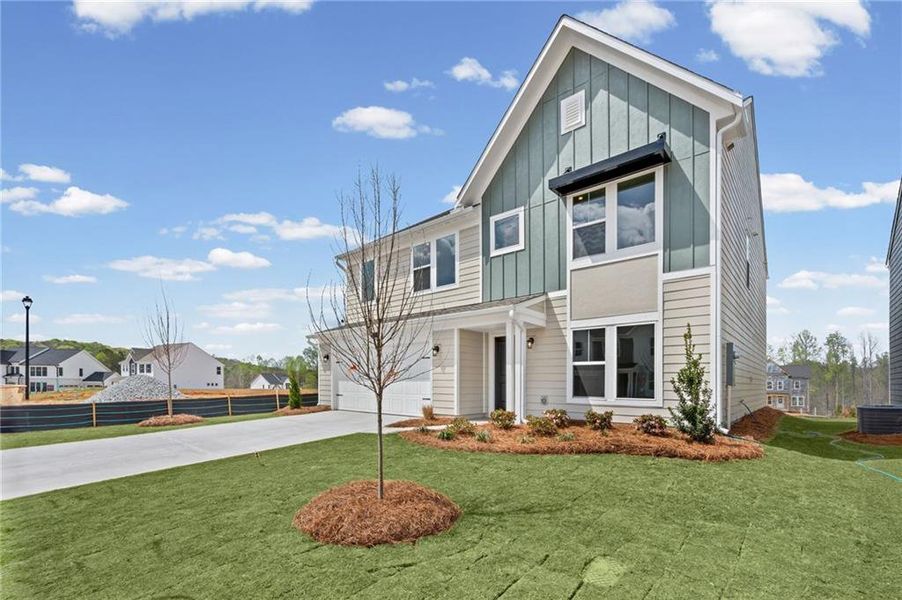 Front exterior of a new home in Twin Lakes, Hoschton, GA, highlighting curb appeal (Image 27).