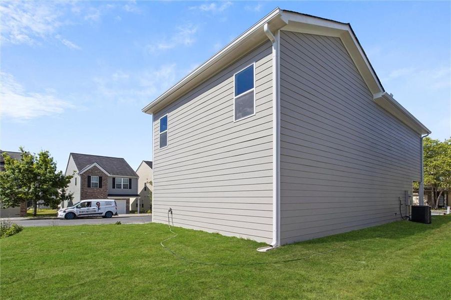 Front exterior of a new home in , Fairburn, GA, highlighting curb appeal (Image 1). Front exterior of a new home in , Fairburn, GA, highlighting curb appeal (Image 1).