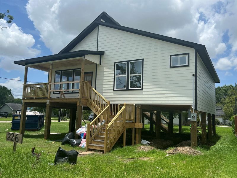 Front of the home in progress before driveways