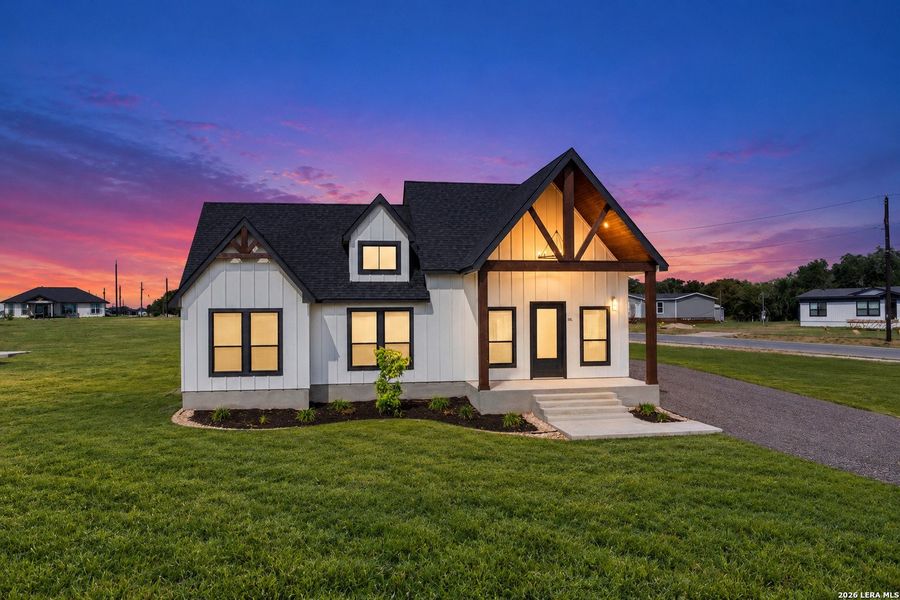 Front exterior of a new home in , Atascosa, TX, highlighting curb appeal (Image 24). Front exterior of a new home in , Atascosa, TX, highlighting curb appeal (Image 24).