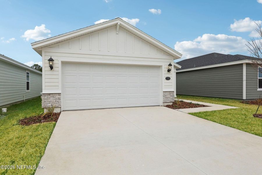 Front exterior of a new home in Kings Preserve, Jacksonville, FL, highlighting curb appeal (Image 19).