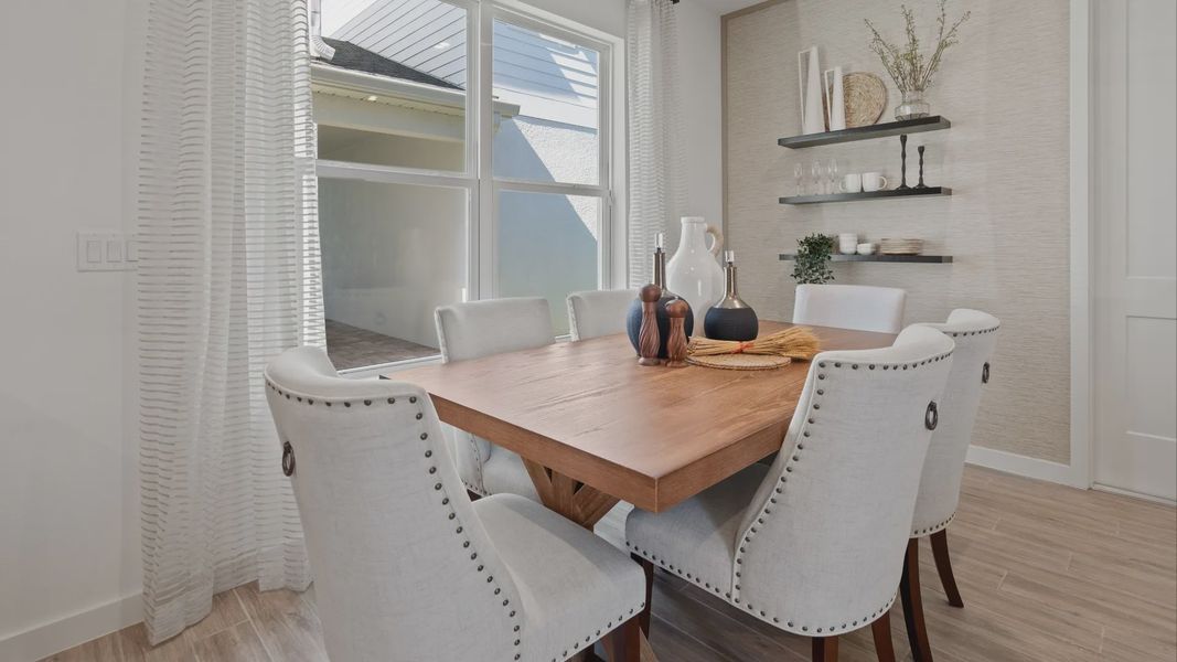 Cozy cafe with large double window in a DRB Home Clementine model at the Trinity Place community.