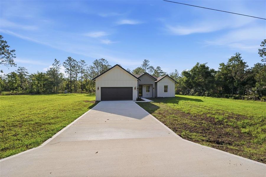 Front exterior of a new home in , Dunnellon, FL, highlighting curb appeal (Image 18). Front exterior of a new home in , Dunnellon, FL, highlighting curb appeal (Image 18).