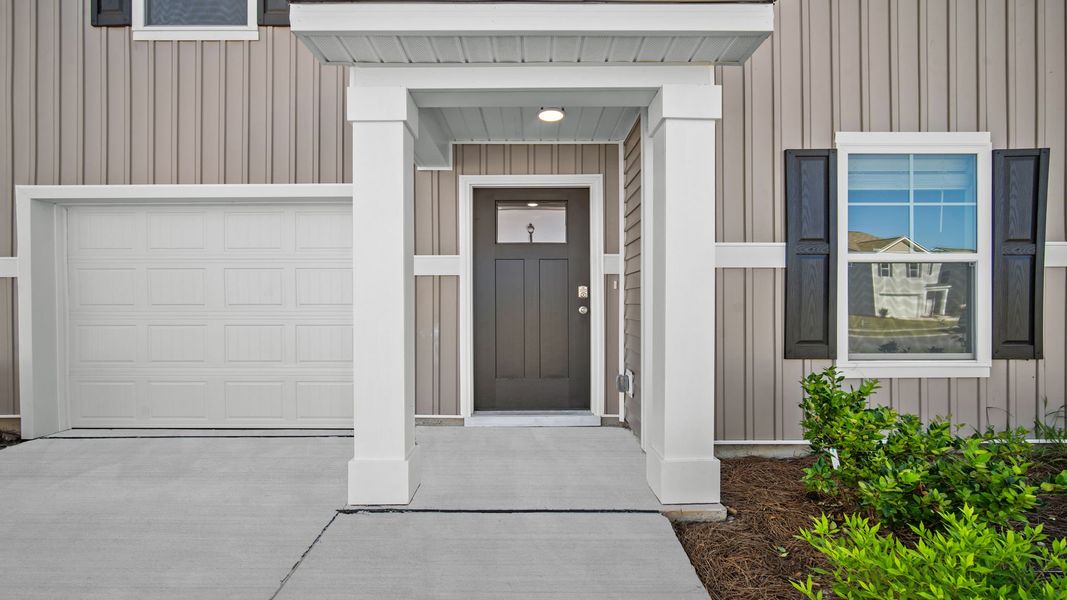 Front exterior of a new home in Cobblestone Village, Savannah, GA, highlighting curb appeal (Image 2).