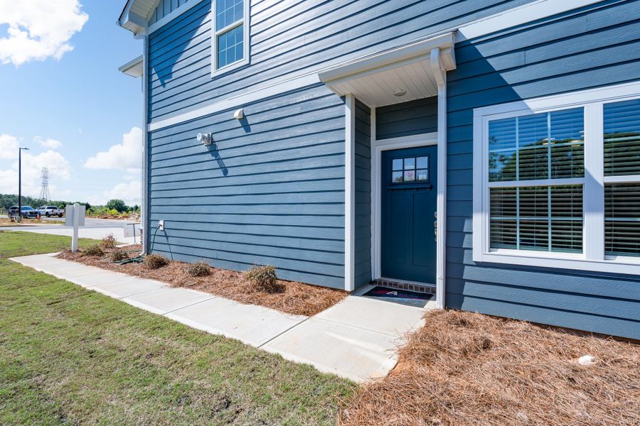 Representative exterior photo of a completed home built from the Plan 1817 Townhome by Adams Homes in Joyner Park, Rocky Mount, NC (Image 22).