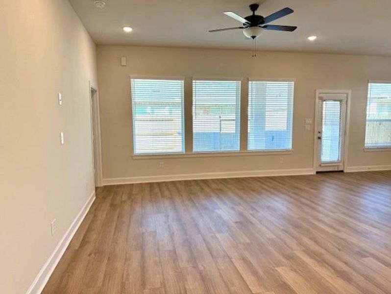 Large Living area overlooks covered rear patio.