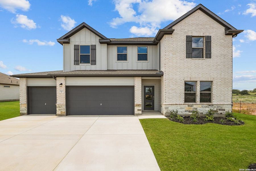 Front exterior of a new home in Hickory Ridge, Elmendorf, TX, highlighting curb appeal (Image 25). Front exterior of a new home in Hickory Ridge, Elmendorf, TX, highlighting curb appeal (Image 25).