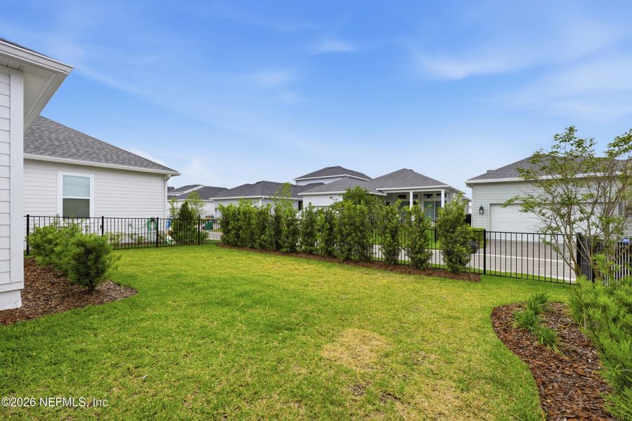 Exterior details and patio area of a home in Seven Pines 70' Rear Entry, Jacksonville (Image 4).