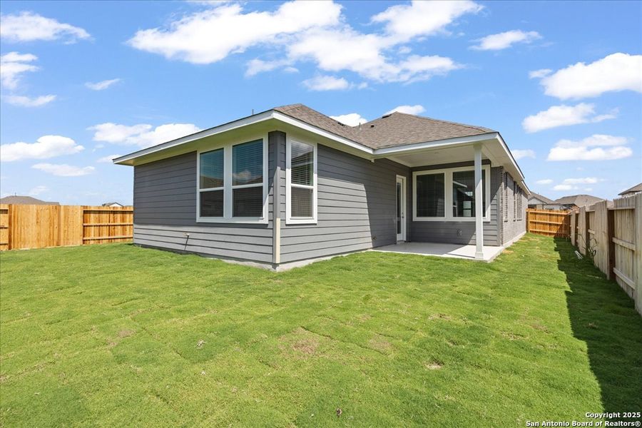 Exterior details and patio area of a home in Village at Three Oaks, Seguin (Image 2).