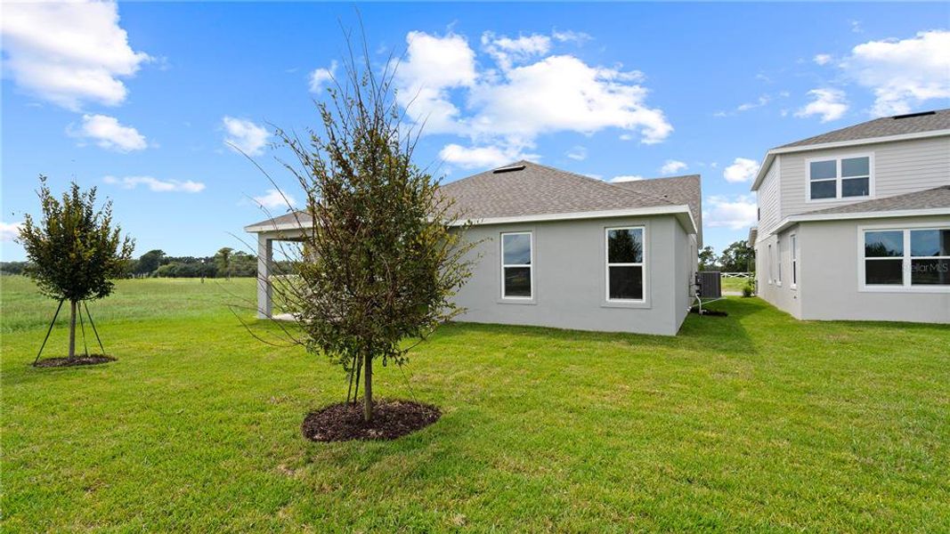 Front exterior of a new home in Trailside, Mount Dora, FL, highlighting curb appeal (Image 2).