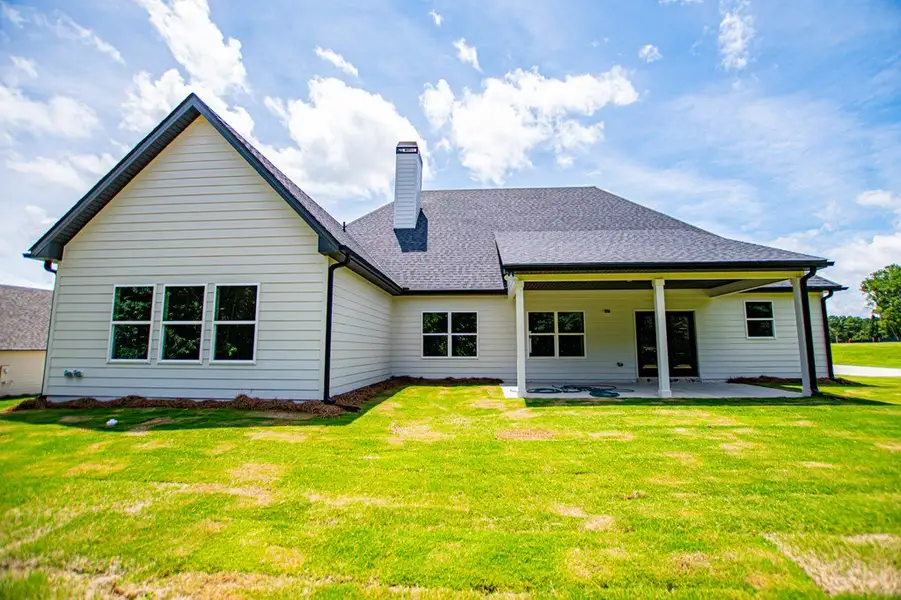 Exterior details and patio area of a home in WOODMONT RESERVE, Roopville (Image 3).