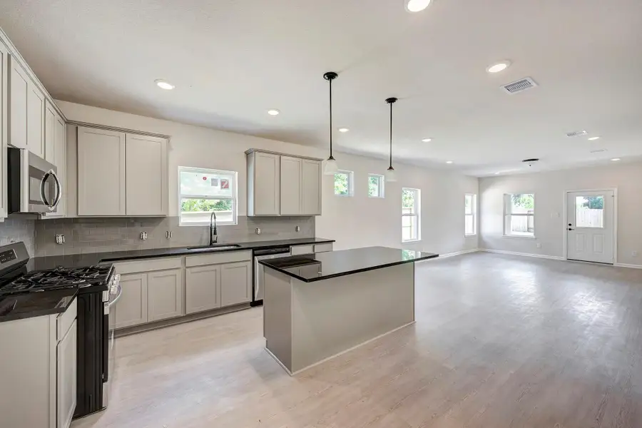 The Davenport II- Kitchen into Family Room. Home under construction. Sample floor plan photo used for illustrative purposes only. Upgrades, selections options, windows and colors may vary. The Davenport II- Kitchen into Family Room. Home under construction. Sample floor plan photo used for illustrative purposes only. Upgrades, selections options, windows and colors may vary.