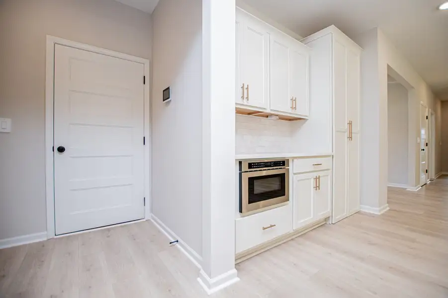 Furnished interior view inside a new home in WOODMONT RESERVE, Roopville (Image 12).