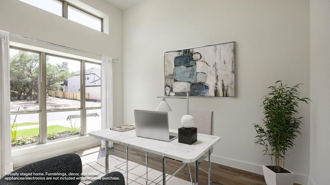 Office space with baseboards, dark wood finished floors, and a towering ceiling Office space with baseboards, dark wood finished floors, and a towering ceiling