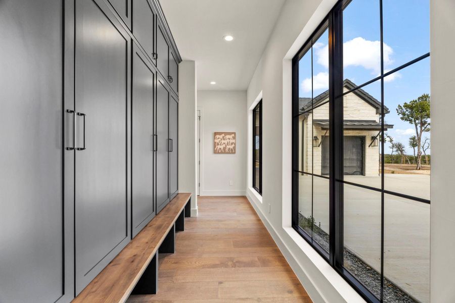 Back entry drop zone off the two car garage with beautiful windows looking out to motor court.