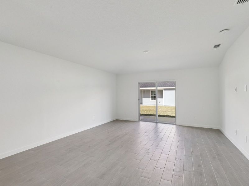 Spacious, unfurnished interior of a new home in Lakes at Bella Lago - Classic Series, Green Cove Springs (Image 8).