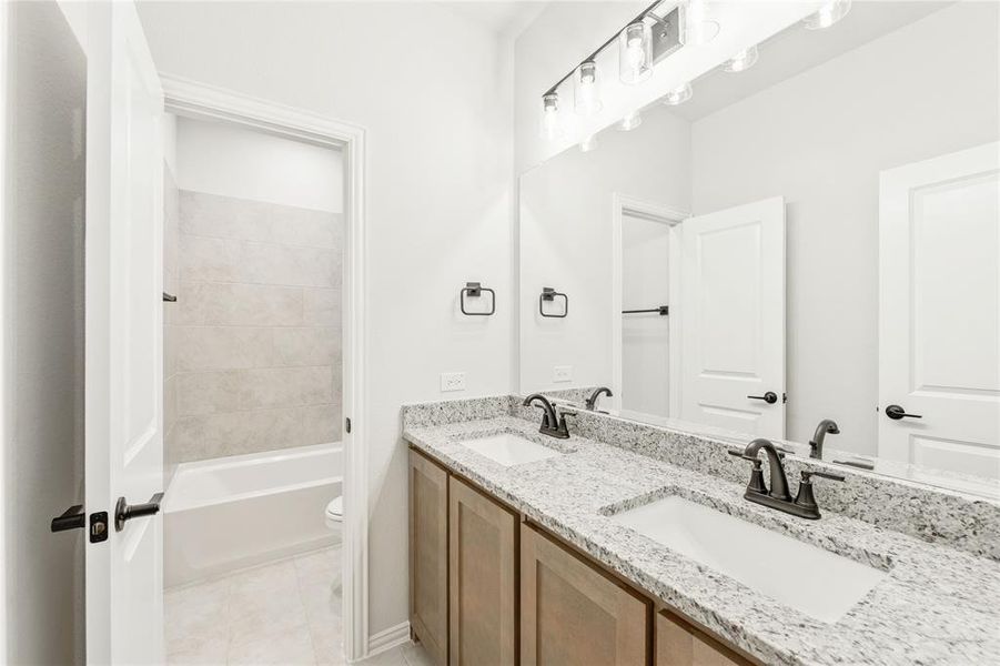 Furnished interior view inside a new home in Stone River Glen, Royse City (Image 9).
