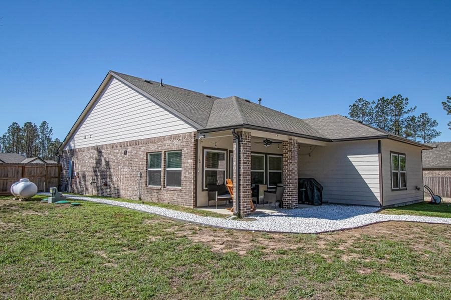 Exterior details and patio area of a home in , Conroe (Image 28).