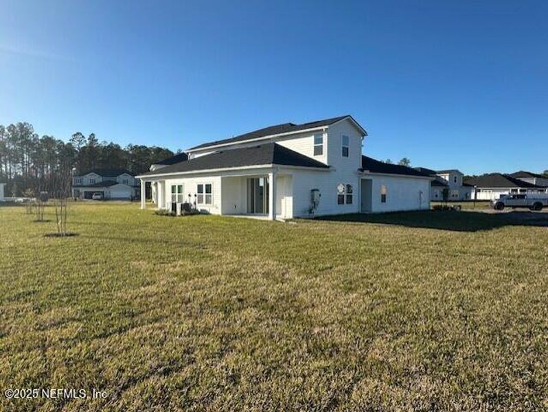 Exterior details and patio area of a home in Brook Forest - Villas, St. Augustine (Image 18).