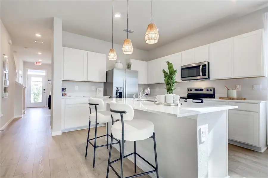 Furnished interior view inside a new home in The Gardens at Bay Street, Sarasota (Image 12). Furnished interior view inside a new home in The Gardens at Bay Street, Sarasota (Image 12).