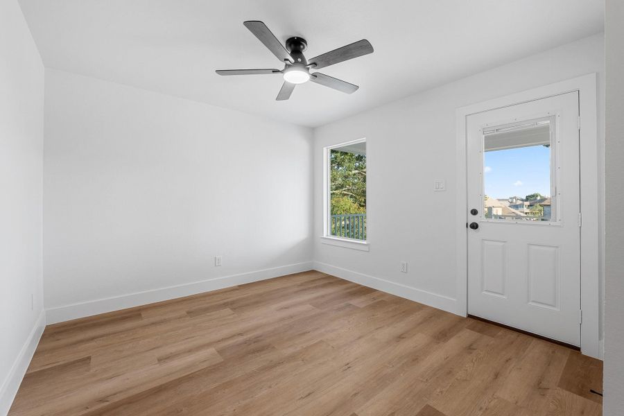 Secondary Bedroom with direct access to a charming front porch deck. Secondary Bedroom with direct access to a charming front porch deck.