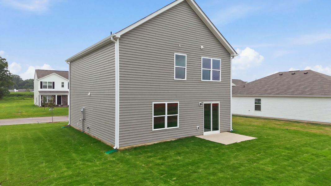 Exterior details and patio area of a home in Hobbs Farm, Ayden (Image 23).