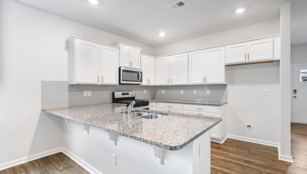 Representative furnished interior of a home built from the Davidson by D.R. Horton in Brookside Farms, Greer (Image 8).