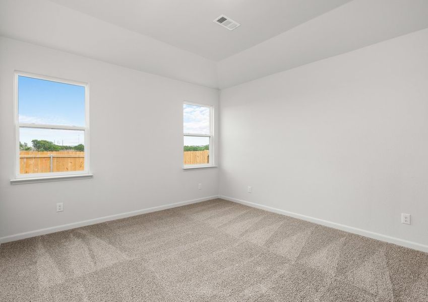 The master bedroom has two large windows. The master bedroom has two large windows.