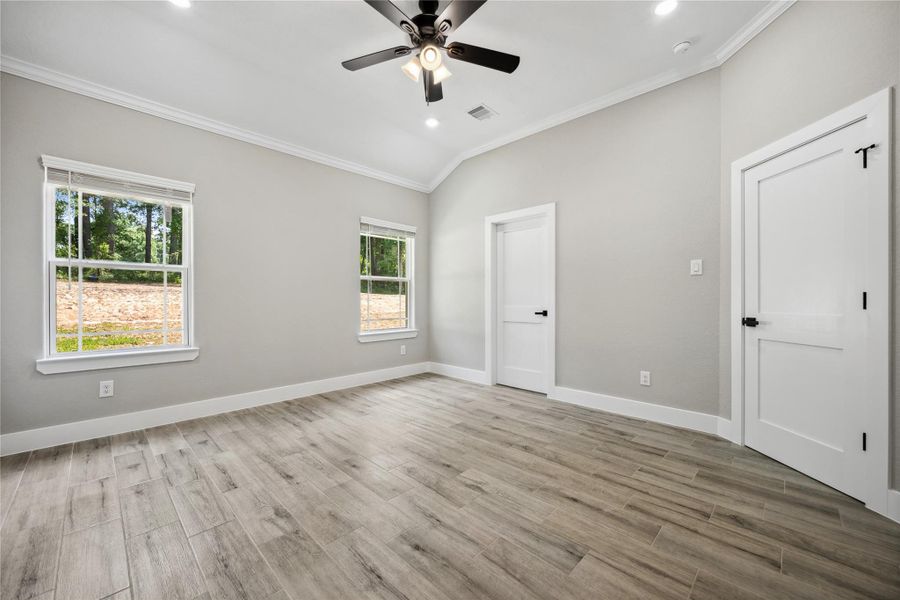 Primary bedroom features an oversized walk in closet and beautiful en-suite.