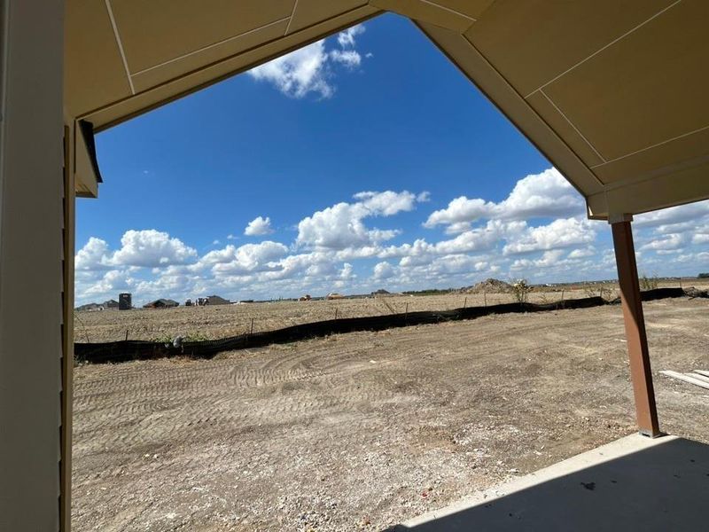View of yard featuring a view of rural / pastoral area and a patio area