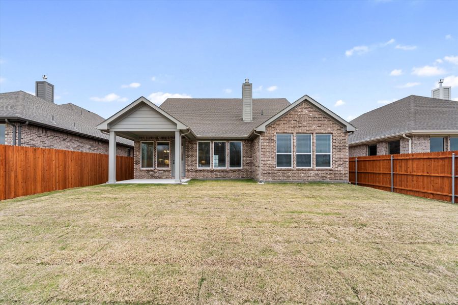 Exterior details and patio area of a home in Morningstar, Aledo (Image 29).
