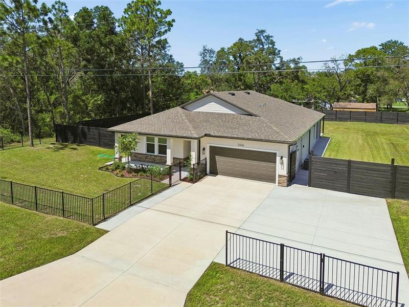 Front exterior of a new home in , Spring Hill, FL, highlighting curb appeal (Image 26).