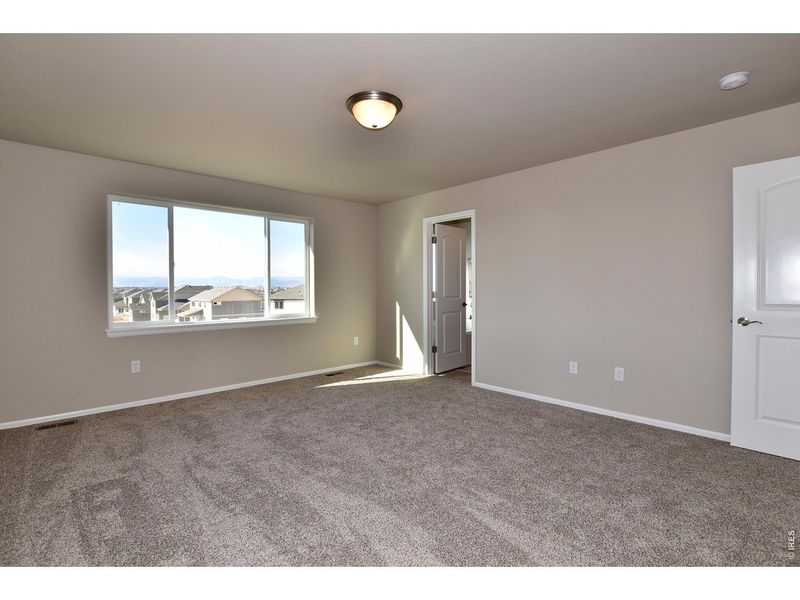 Spacious, unfurnished interior of a new home in Union Colony West, Greeley (Image 21).