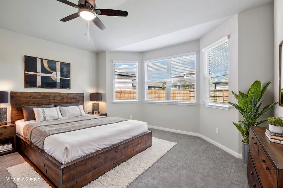 Virtually staged primary suite in the Medina floorplan at a Meritage Homes community.