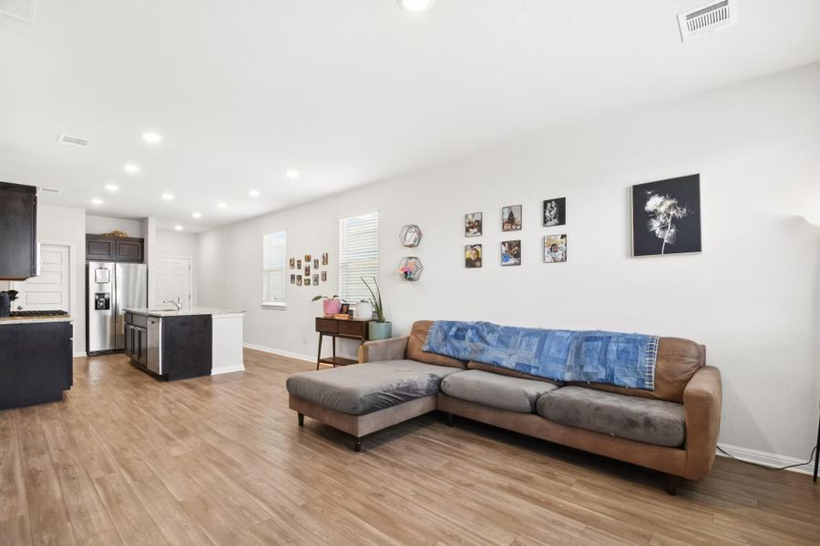 An open-concept living area leads to island kitchen An open-concept living area leads to island kitchen