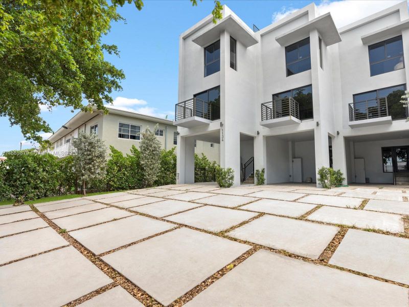 Front exterior of a new home in , Miami Beach, FL, highlighting curb appeal (Image 1). Front exterior of a new home in , Miami Beach, FL, highlighting curb appeal (Image 1).