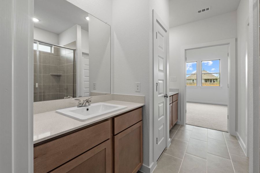 Primary Bathroom in the Pearl home plan by Trophy Signature Homes – REPRESENTATIVE PHOTO