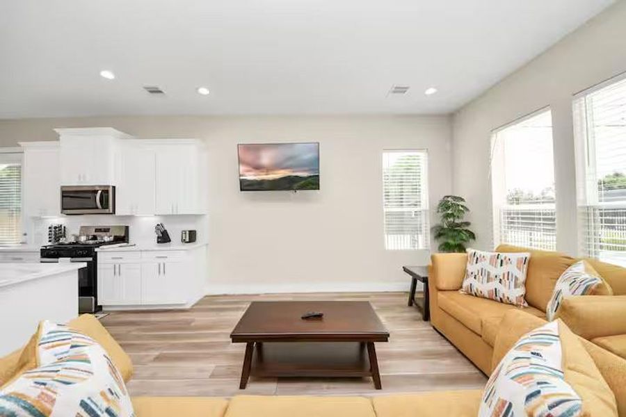 The main living space keeps everything connected, giving you an easy flow from relaxing on the couch to cooking, dining, and entertaining.