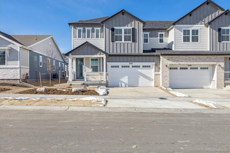 Front exterior of a new home in Skyview at High Point, Aurora, CO, highlighting curb appeal (Image 4). Front exterior of a new home in Skyview at High Point, Aurora, CO, highlighting curb appeal (Image 4).