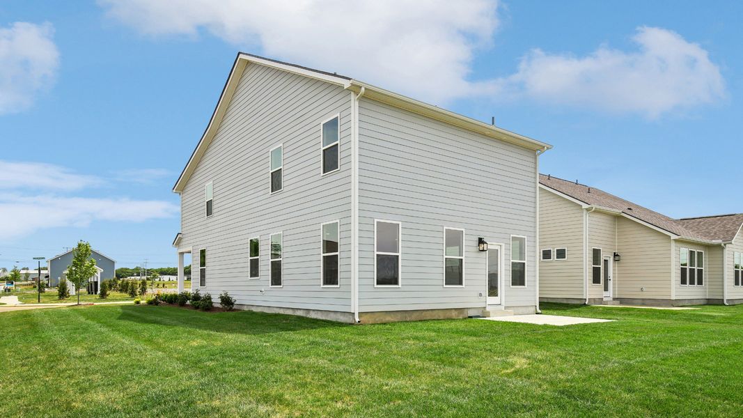 Large Backyard of home with small back patio