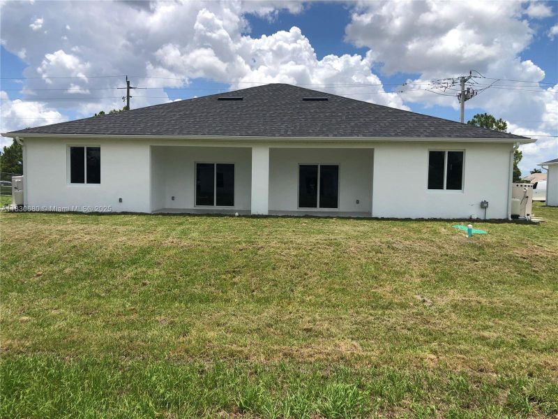 Front exterior of a new home in , Lehigh Acres, FL, highlighting curb appeal (Image 2). Front exterior of a new home in , Lehigh Acres, FL, highlighting curb appeal (Image 2).