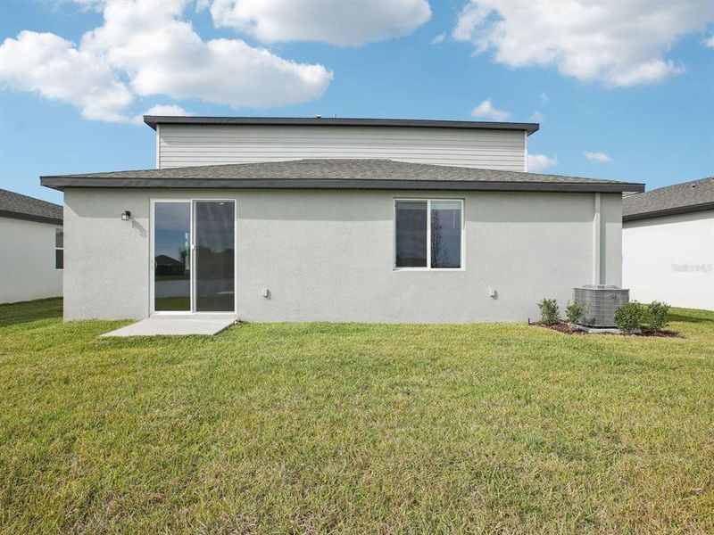 Exterior details and patio area of a home in The Grove at Stuart Crossing - Classic Series, Bartow (Image 3).